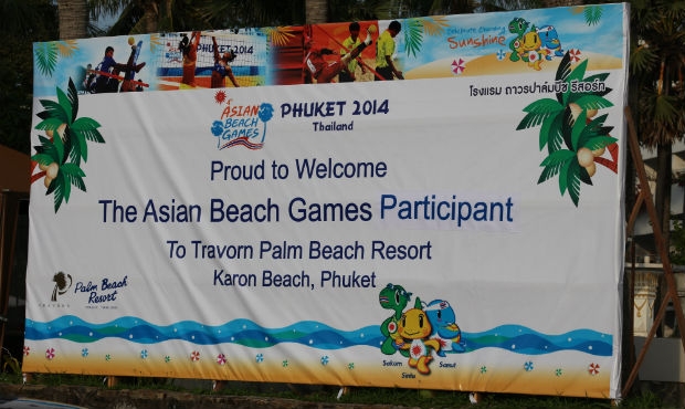 People with red flags, sambo jacket kurtkas, golden sand and other tints of sambo tournament in the program of Asian Beach Games – 2014